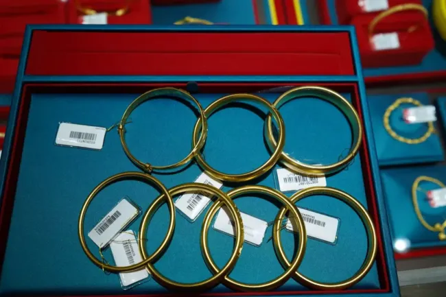 女子购买130克黄金店主报警