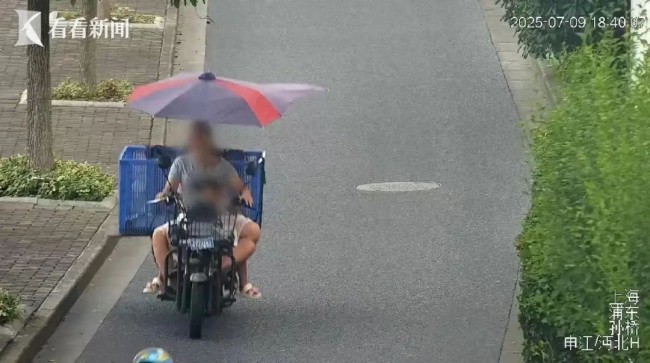 危险行为大赏:女子骑车带娃不戴头盔闯红灯上高速