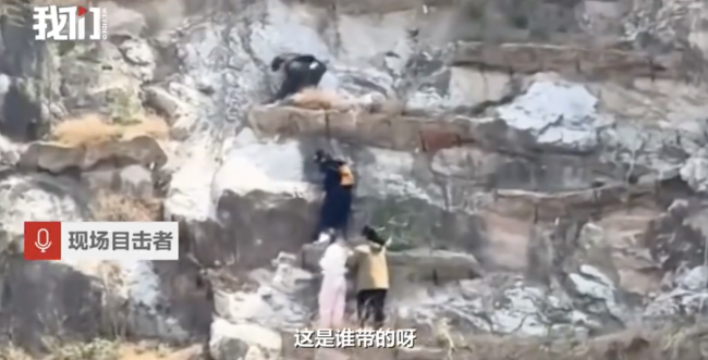 驴友被困崖壁路人隔山喊到嗓子疼 消防成功救援
